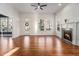 Bright living room boasts a fireplace, hardwood floors, and large windows at 970 Welch Sw St, Atlanta, GA 30310