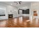 Spacious living room with fireplace, hardwood floors and large windows at 970 Welch Sw St, Atlanta, GA 30310