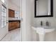Charming powder room with a pedestal sink and modern fixtures at 970 Welch Sw St, Atlanta, GA 30310