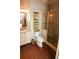 Well-appointed bathroom with framed art and custom tiled walk-in shower at 184 Cadence Trl, Canton, GA 30115