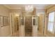 Lavish bathroom with glass shower, dual walk-in closets, chandelier, and custom finishes at 184 Cadence Trl, Canton, GA 30115