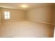 Expansive bedroom featuring neutral walls, plush carpet and a window with plantation shutters at 184 Cadence Trl, Canton, GA 30115