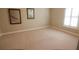 Bright bedroom featuring neutral walls, plush carpet and a window with plantation shutters at 184 Cadence Trl, Canton, GA 30115