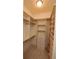 Spacious walk-in closet with custom shelving and drawers to maximize storage at 184 Cadence Trl, Canton, GA 30115