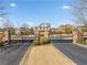 Elegant gated community entrance with stone pillars and mature landscaping at 184 Cadence Trl, Canton, GA 30115