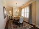 Formal dining room with a chandelier, shuttered windows, and stylish decor at 184 Cadence Trl, Canton, GA 30115