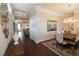 Elegant dining room with hardwood floors, chandelier, and access to other living areas at 184 Cadence Trl, Canton, GA 30115