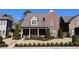 Charming brick home with manicured lawn and lush landscaping creates inviting curb appeal at 184 Cadence Trl, Canton, GA 30115