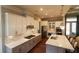 Open kitchen with quartz countertops, center island, modern appliances and lots of cabinet space at 184 Cadence Trl, Canton, GA 30115