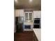Spacious kitchen with stainless steel appliances, double ovens and quartz countertops at 184 Cadence Trl, Canton, GA 30115