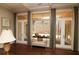 Inviting living room with large windows, elegant curtains, and comfortable seating at 184 Cadence Trl, Canton, GA 30115