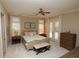Comfortable bedroom with carpet, double doors to the patio, and ample natural light at 184 Cadence Trl, Canton, GA 30115