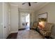 Well-lit office with French doors to the outdoor patio and two striped chairs at 184 Cadence Trl, Canton, GA 30115