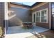 Cozy outdoor patio with a table and chairs, perfect for relaxing or entertaining at 184 Cadence Trl, Canton, GA 30115