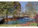 Scenic pond with a fountain and lush trees provides a tranquil community space at 184 Cadence Trl, Canton, GA 30115