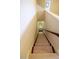 View of a carpeted staircase leading down, with a wooden handrail and white walls at 184 Cadence Trl, Canton, GA 30115
