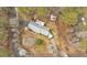 Aerial view of the property showcasing its layout, driveway, and surrounding landscape at 303 Fireside Trl, Douglasville, GA 30134