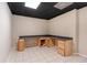 Basement workspace featuring a large countertop and cabinets with a tile floor at 303 Fireside Trl, Douglasville, GA 30134