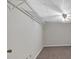 An unfinished basement with carpet, shelving, and utility connections at 303 Fireside Trl, Douglasville, GA 30134