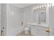 Clean bathroom featuring a shower-tub combo, toilet, and vanity with great lighting at 303 Fireside Trl, Douglasville, GA 30134