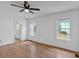 Bedroom with ceiling fan, hardwood floors, neutral paint, and multiple windows at 303 Fireside Trl, Douglasville, GA 30134