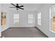 Bedroom with carpet, white walls, a ceiling fan, and lots of natural light at 303 Fireside Trl, Douglasville, GA 30134