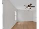 Bedroom with ceiling fan, hardwood floors, neutral paint, and a large window at 303 Fireside Trl, Douglasville, GA 30134