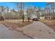 Long driveway leading up to the house, carport and shed at 303 Fireside Trl, Douglasville, GA 30134