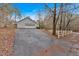 Driveway leading to a detached two car garage and additional parking at 303 Fireside Trl, Douglasville, GA 30134