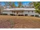 Charming ranch style home featuring light gray siding and a welcoming front porch at 303 Fireside Trl, Douglasville, GA 30134