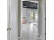 Hallway with white tile flooring leading to an adjacent room at 303 Fireside Trl, Douglasville, GA 30134