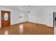 Hardwood floor living room with a wooden front door and neutral paint at 303 Fireside Trl, Douglasville, GA 30134