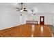 Open concept living room with hardwood floors and a wooden door at 303 Fireside Trl, Douglasville, GA 30134