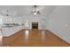 Living room boasts a brick fireplace, hardwood floors, and modern lighting at 303 Fireside Trl, Douglasville, GA 30134