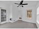 Cozy sunroom with multiple windows and doors, plus a ceiling fan at 303 Fireside Trl, Douglasville, GA 30134