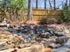 Backyard features a stone waterfall with garden ornaments at 3304 Woolbridge Ct, Marietta, GA 30062