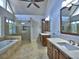 Primary bathroom featuring soaking tub, glass shower, and double vanity sinks, with modern fixtures at 3304 Woolbridge Ct, Marietta, GA 30062
