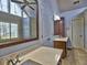 Bright bathroom boasts double sinks, a large mirror, neutral tones, and a fan at 3304 Woolbridge Ct, Marietta, GA 30062