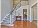 Inviting foyer showcasing hardwood floors and a staircase leading to the upper level at 3304 Woolbridge Ct, Marietta, GA 30062