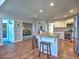 Kitchen with granite island, stainless appliances, breakfast bar, and tiled floors at 3304 Woolbridge Ct, Marietta, GA 30062