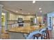 Bright kitchen featuring an eat-in breakfast bar, stainless steel appliances, and ample cabinet space at 3304 Woolbridge Ct, Marietta, GA 30062