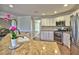 Kitchen with white cabinets, granite countertops, stainless steel appliances, and a tile backsplash at 3304 Woolbridge Ct, Marietta, GA 30062