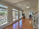 Living room with hardwood floors, staircase, fireplace, and lots of natural light from the many windows at 3304 Woolbridge Ct, Marietta, GA 30062