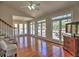 Bright living room with hardwood floors, fireplace, staircase, and lots of natural light from the many windows at 3304 Woolbridge Ct, Marietta, GA 30062