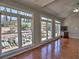 Living room with hardwood floors, fireplace, staircase, and lots of natural light from the many windows at 3304 Woolbridge Ct, Marietta, GA 30062