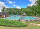 Community pool featuring lounge seating and covered gazebo at 3304 Woolbridge Ct, Marietta, GA 30062