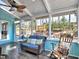 Bright sunroom featuring screened windows, skylights, ceiling fan, with a view of the backyard at 3304 Woolbridge Ct, Marietta, GA 30062