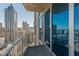 Enjoy the city views from this condo balcony with sliding glass doors and metal railings at 400 W Peachtree Nw St # 3412, Atlanta, GA 30308