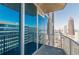 A condo balcony showcasing expansive city views with glass sliding doors and steel railings at 400 W Peachtree Nw St # 3412, Atlanta, GA 30308