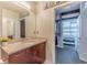 Bathroom features a granite countertop, modern fixtures, and access to the main bedroom at 400 W Peachtree Nw St # 3412, Atlanta, GA 30308